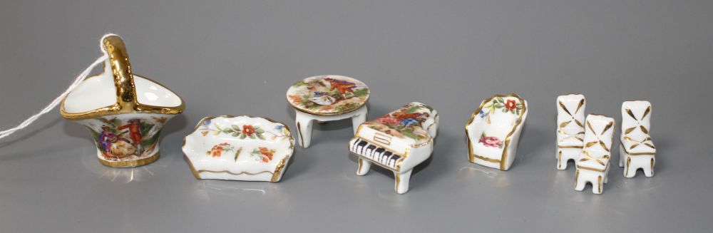 An eight piece Limoges porcelain miniature salon suite and a similar basket, 4.5cm